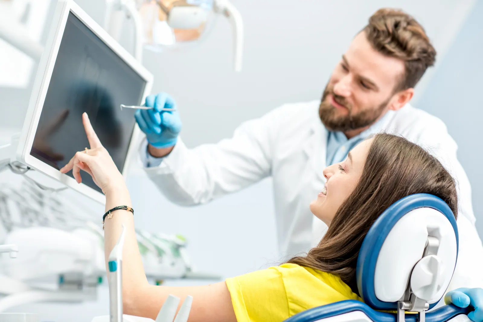 Clear aligner trays held in hand